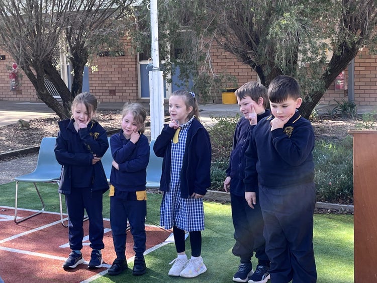 k12 reciting a book for education week